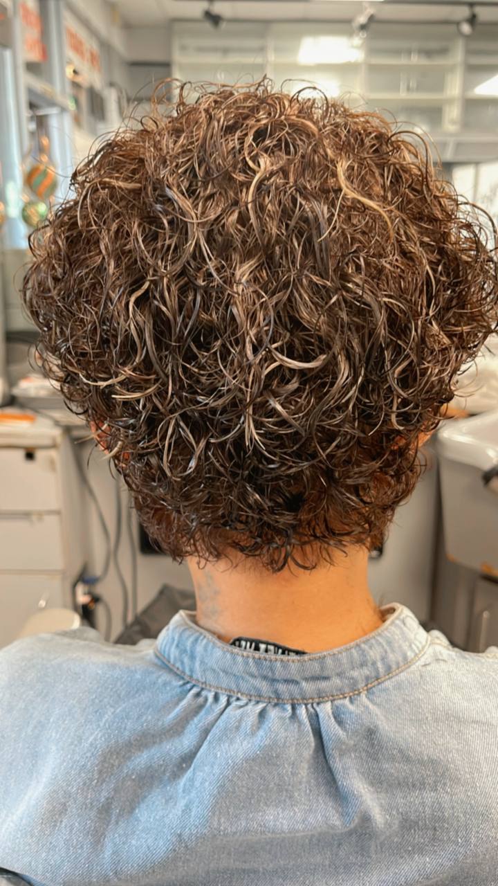Tight classic perm with subtle woven highlights
