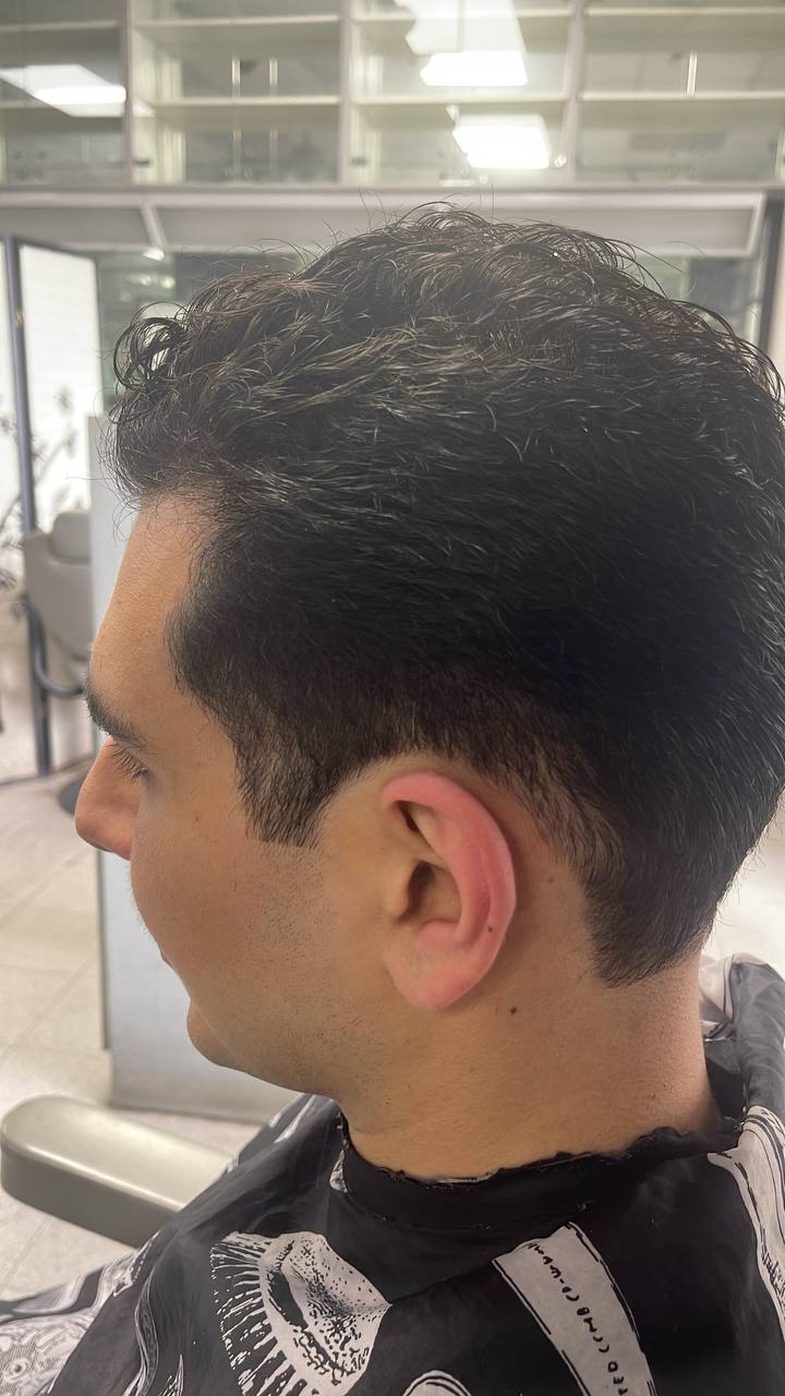 Men's wavy cut with a clean tapered neckline