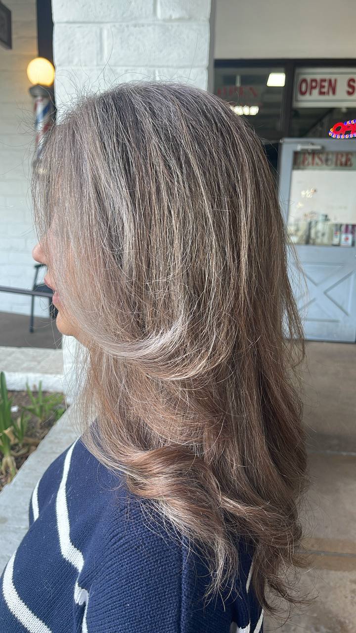 Long bronde layers with face-framing highlights
