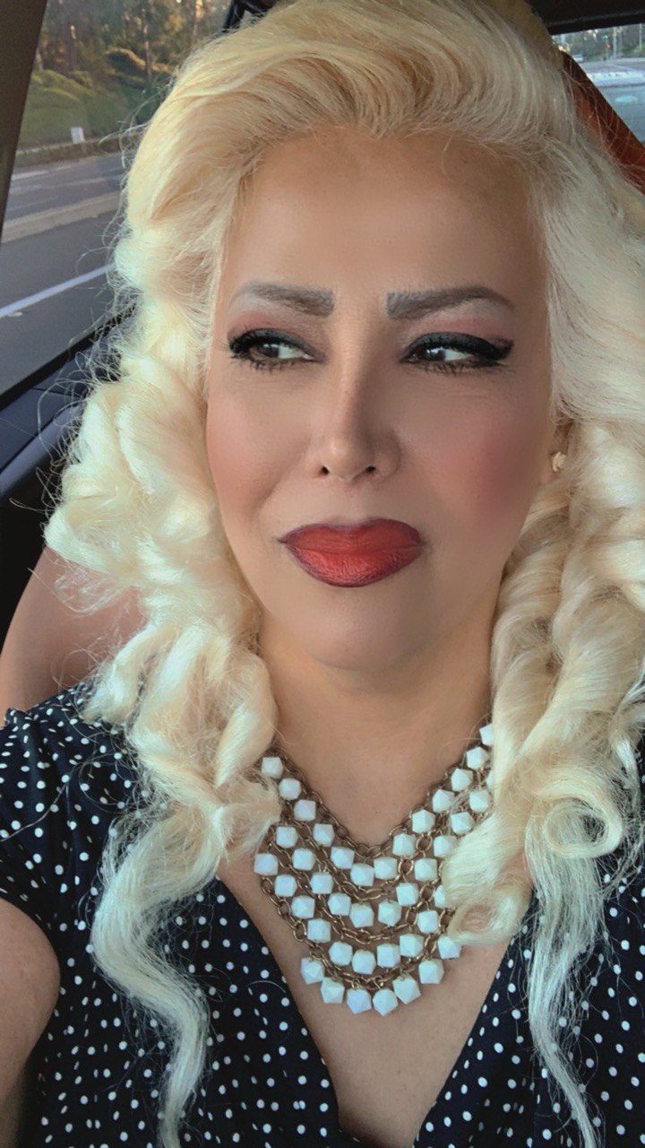 Me — Nas, soft blonde curls, a red lip, and my favorite beaded necklace